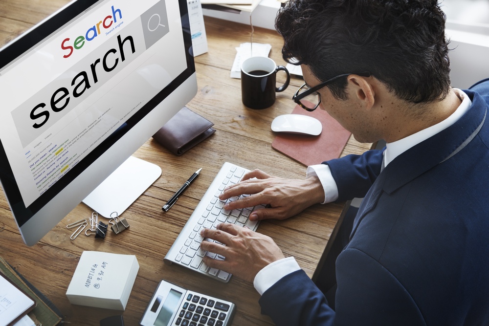 man in suit using search engine